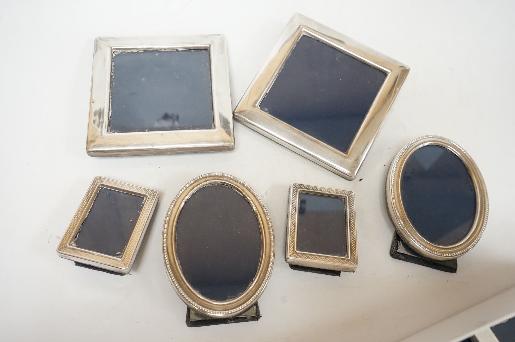 Four assorted pairs of modern silver mounted photograph frames, including Carr's Of Sheffield, 1992/3 and 1990, together with twelve other small assorted modern silver mounted photograph frames, largest 12.9cm and a silv